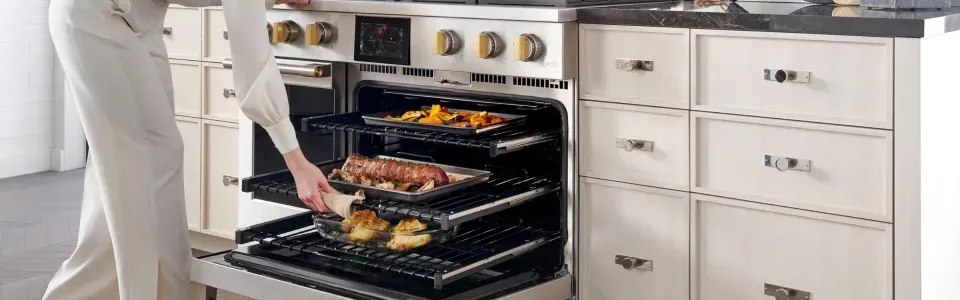 photo of Monogram multi-tier oven range being used to cook a big dinner